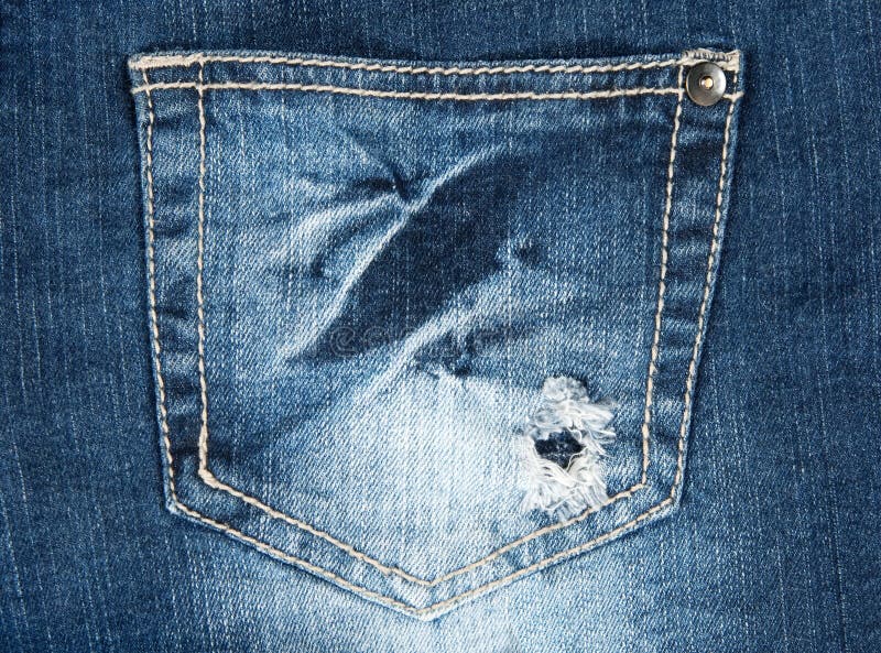 Hole in a pocket of old jeans