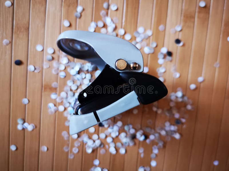 Hole Puncher with Paper Confetti. Stock Photo Image of unit, office