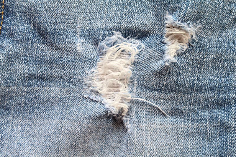 Hole and Threads on Denim Jeans Stock Photo - Image of clothes, style ...