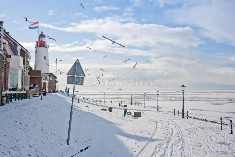 Seafront of Dutch fishing village in snowy wintertime. Seafront of Dutch fishing village in snowy wintertime