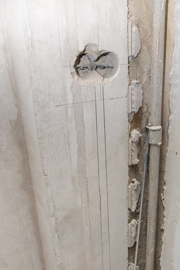 Holes in the Wall for Sockets. Electrical Wiring in the Wall Stock