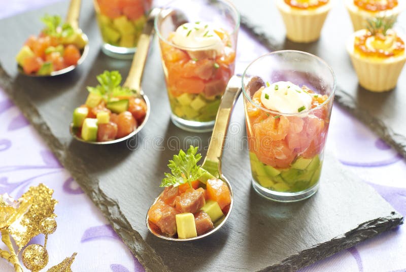 Holiday appetizers with salmon and red caviar royalty free stock images