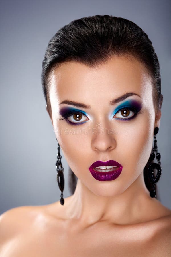 Holiday make up. Stylish beauty young woman face