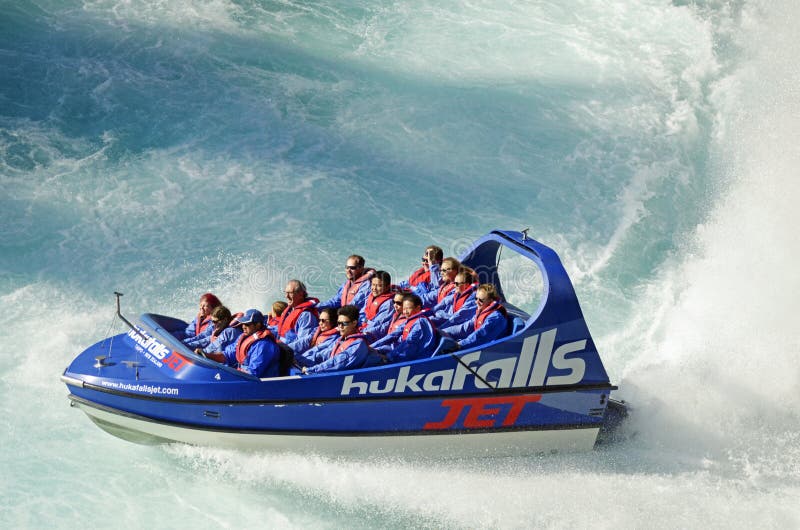 holiday makers people enjoying thrill of jet boat ride