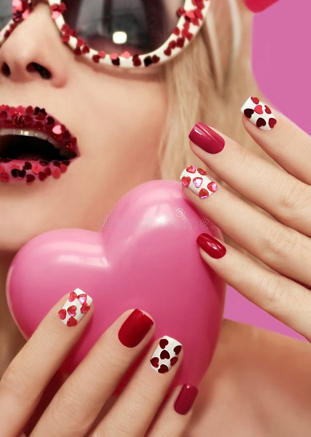 Holiday makeup and manicure with red hearts