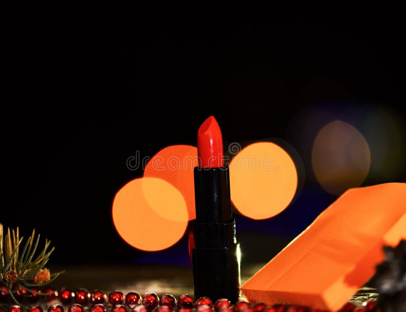 Holiday xmas decorative colorful lipstick with defocused bokeh light and on colorful background, copy spac stock images