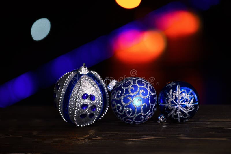 Holiday xmas decorative colorful toy or balls with defocused bokeh light on colorful background, copy spac stock photography