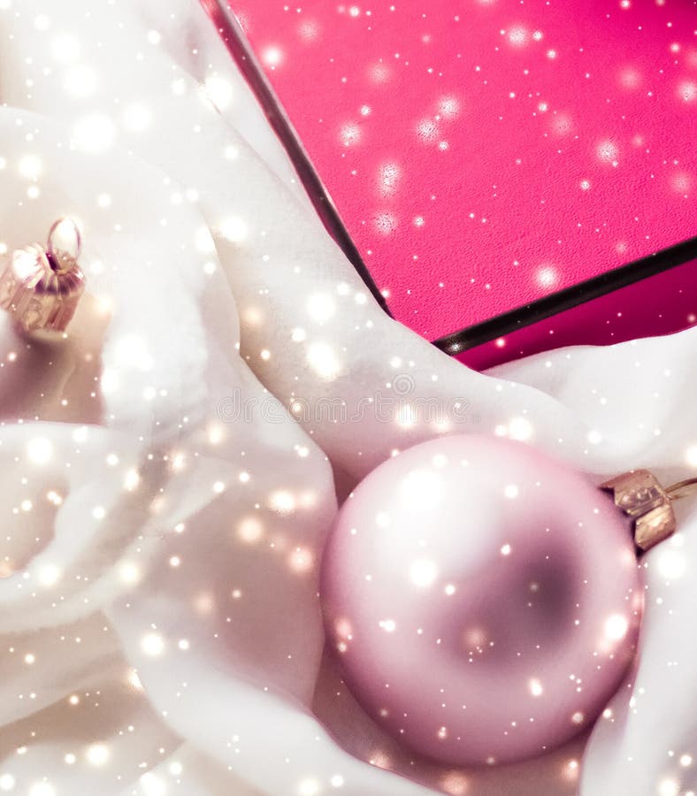 Christmas magic holiday background, festive baubles, pink vintage gift box and golden glitter as winter season present for luxury stock photos Christmas magic holiday background, festive baubles, pink vintage gift box and golden glitter as winter season present for luxury stock photos