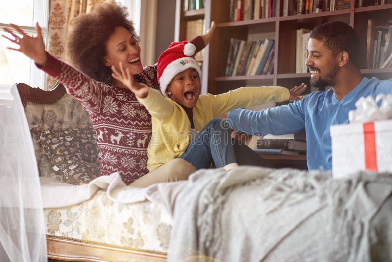 Holidays and celebration concept - Happy African American family celebrate Christmas royalty free stock images Holidays and celebration concept - Happy African American family celebrate Christmas royalty free stock images