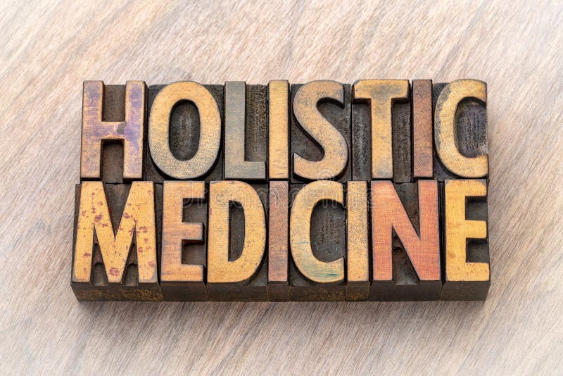Holistic medicine - word abstract in wood type