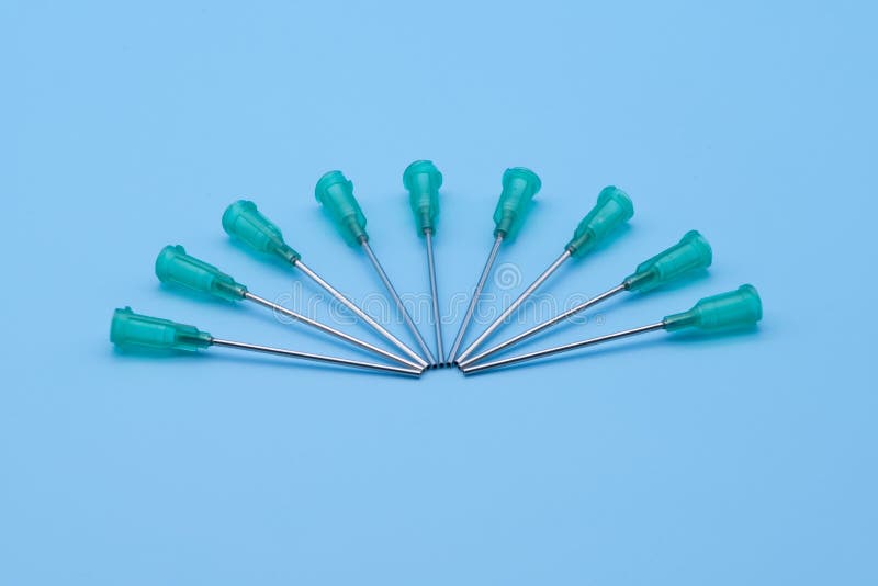Hollow Blunt Needles for Syringes Isolated Against a Blue Background