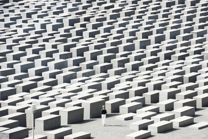 Holocaust Memorial Berlin - Memorial for the Murdered Jews - lonly woman between concrete slabs