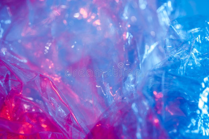 Abstract trendy holographic background in the style of the 80-90s. Real texture of crumpled cellophane film in bright acid colors. Synthwave Vaporwave webpunk Massurrealism aesthetics. Abstract trendy holographic background in the style of the 80-90s. Real texture of crumpled cellophane film in bright acid colors. Synthwave Vaporwave webpunk Massurrealism aesthetics.