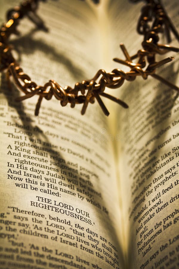 View in Sepia of the Holy Bible with the crown of thorns casting a shadow in the shape of a heart.