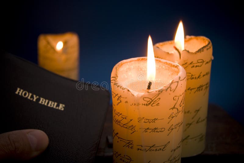 Holy bible by candlelight