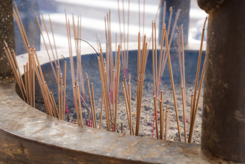 Incense Joss Stick Burning Slowly with Fragrant Smell Smoke. People