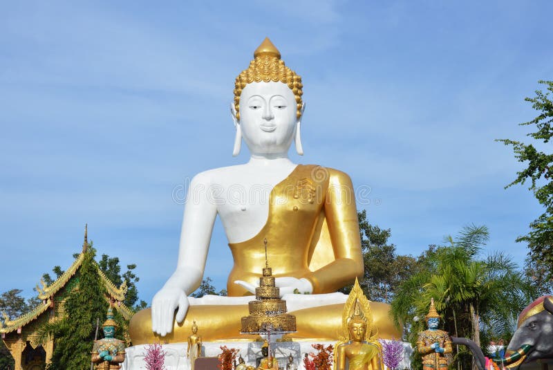 Holy white Buddha image in Wat Phrathat Doi Kham ancient temple in Thailand stock images Holy white Buddha image in Wat Phrathat Doi Kham ancient temple in Thailand stock images