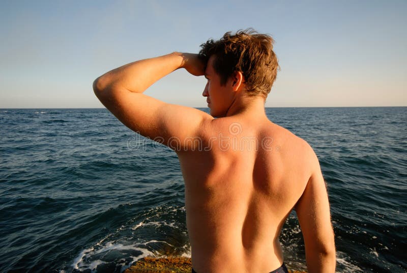 Young man on background of dark blue sky, summer evening. Young man on background of dark blue sky, summer evening