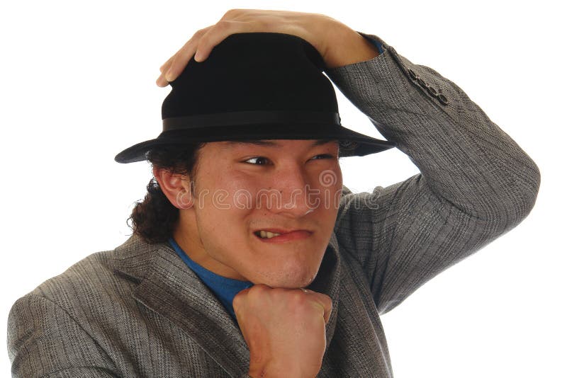 Hombre asiático en un sombrero foto de archivo libre de regalías Hombre asiático en un sombrero foto de archivo libre de regalías