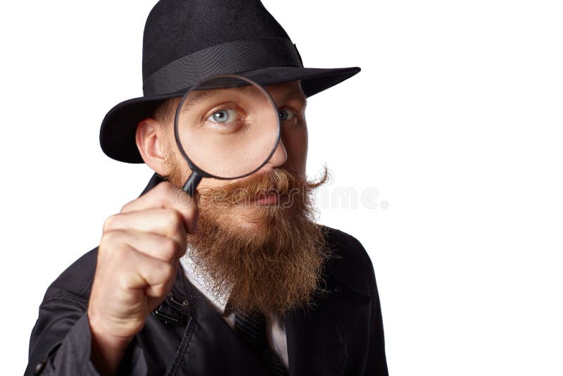 Bearded mustached man looking through a magnifying glass. A man wearing a wide-brimmed hat and cloak. White background. Bearded mustached man looking through a magnifying glass. A man wearing a wide-brimmed hat and cloak. White background.