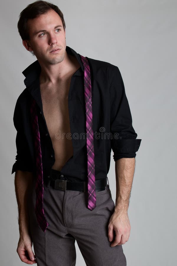 Hombre bien vestido… El desnudar fotos de archivo Hombre bien vestido… El desnudar fotos de archivo