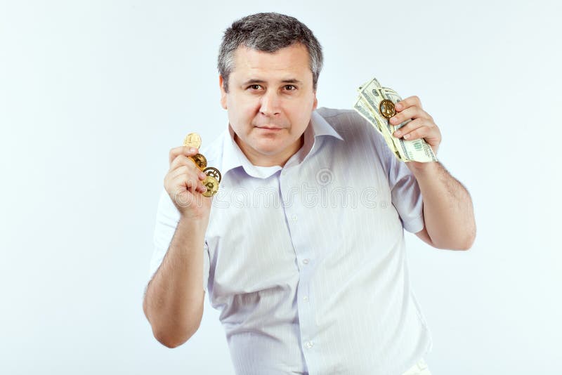 Hombre con Bitcoins imagen de archivo Hombre con Bitcoins imagen de archivo