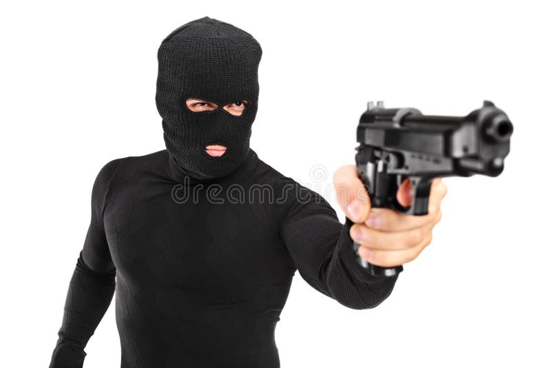 Hombre con la máscara que sostiene un arma foto de archivo Hombre con la máscara que sostiene un arma foto de archivo