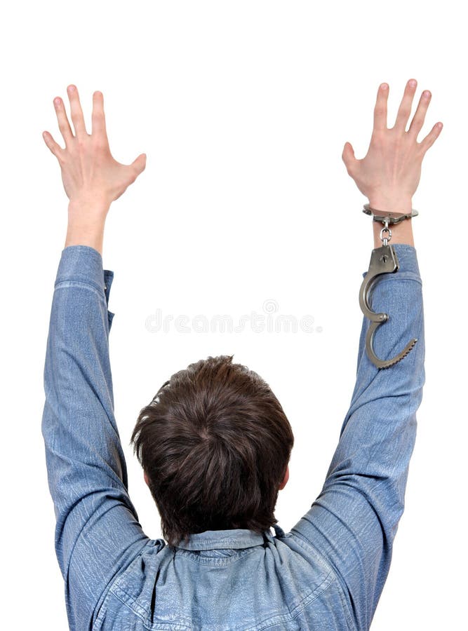 Rear View of the Man with Hands up and Unlocked Handcuffs Isolated on the White Background. Rear View of the Man with Hands up and Unlocked Handcuffs Isolated on the White Background