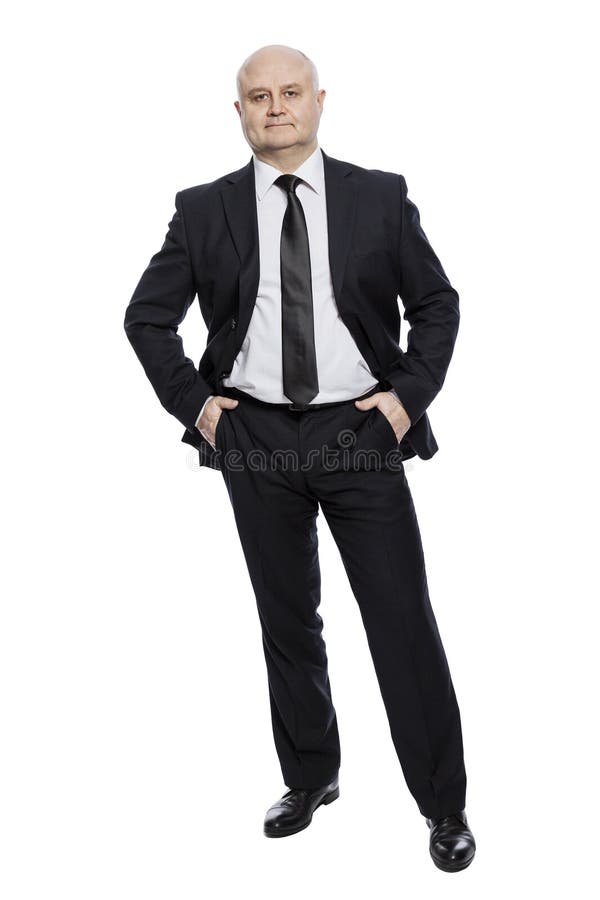 Hombre de mediana edad calvo en un traje en crecimiento completo vertical Aislado en un fondo blanco foto de archivo Hombre de mediana edad calvo en un traje en crecimiento completo vertical Aislado en un fondo blanco foto de archivo