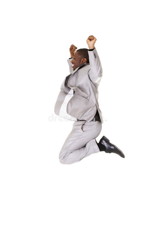 Salto acertado feliz del hombre de negocios fotografía de archivo
