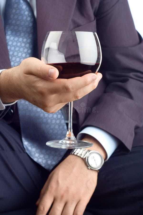 Hombre de negocios con clase con una bebida fotografía de archivo Hombre de negocios con clase con una bebida fotografía de archivo