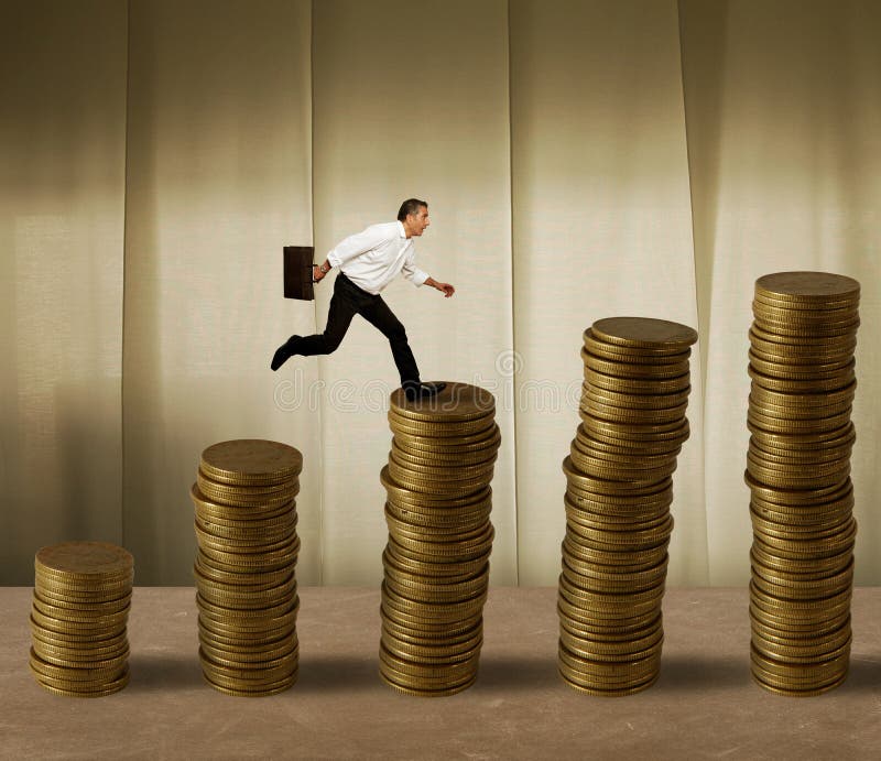 Hombre de negocios de salto en el dinero foto de archivo Hombre de negocios de salto en el dinero foto de archivo