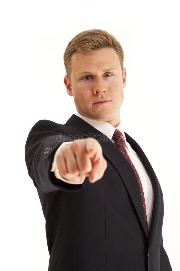 Portrait of smiling young businessman pointing finger at camera. Portrait of smiling young businessman pointing finger at camera