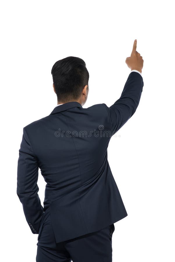 Hombre de negocios joven aislado que señala, visión trasera imagen de archivo Hombre de negocios joven aislado que señala, visión trasera imagen de archivo