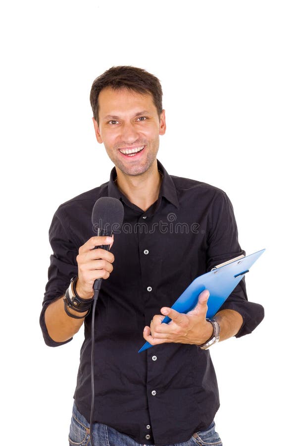 Hombre de negocios joven con las notas que anuncia en el micrófono fotos de archivo libres de regalías Hombre de negocios joven con las notas que anuncia en el micrófono fotos de archivo libres de regalías
