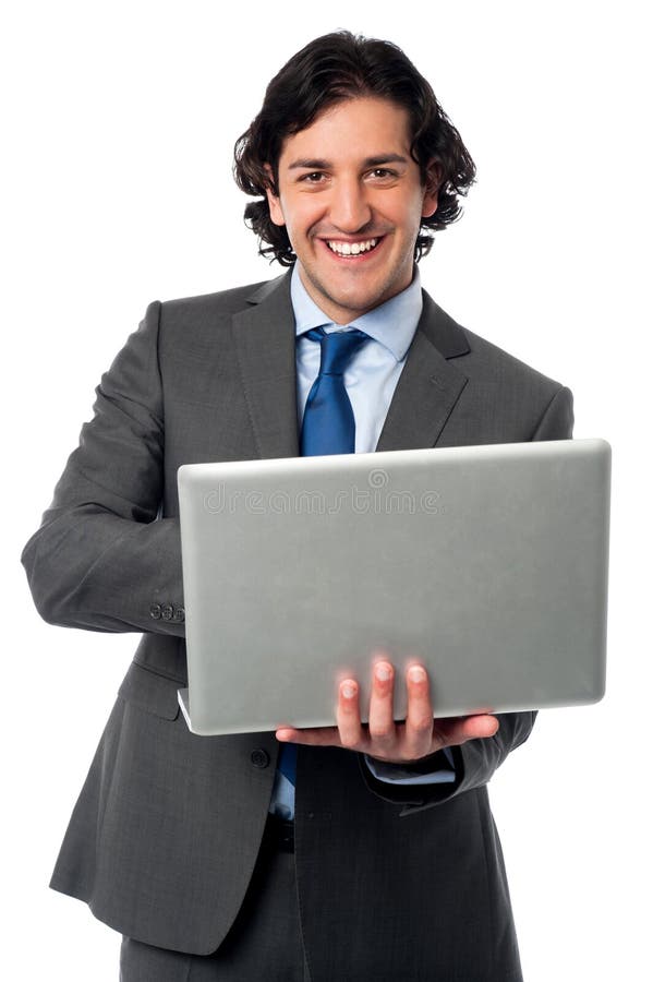 Hombre de negocios que actúa su ordenador portátil foto de archivo Hombre de negocios que actúa su ordenador portátil foto de archivo