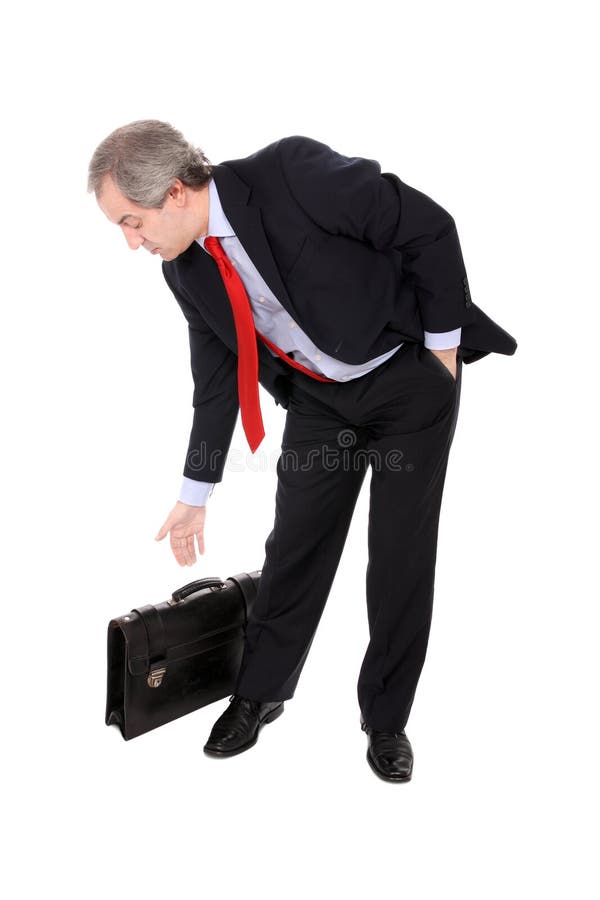 Hombre de negocios que escoge su cartera foto de archivo Hombre de negocios que escoge su cartera foto de archivo