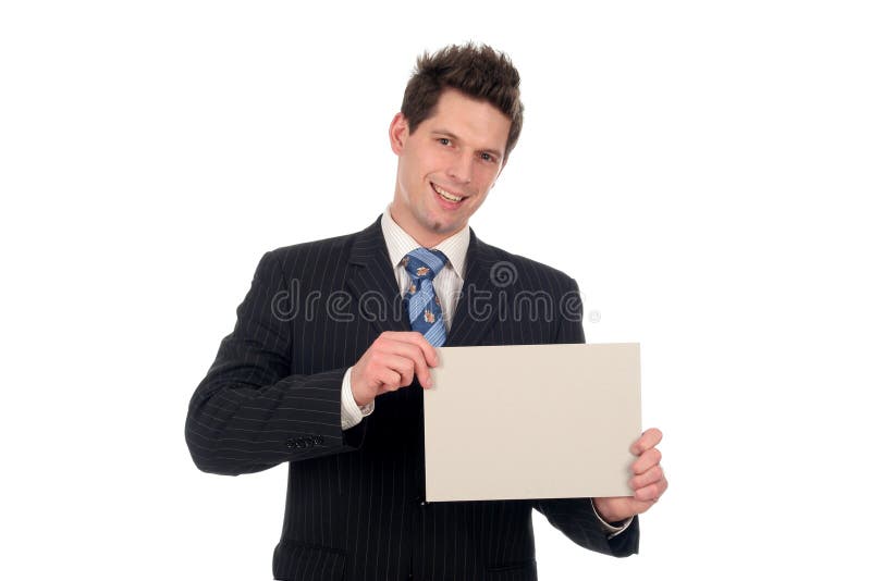 Hombre de negocios que lleva a cabo la muestra en blanco imagen de archivo libre de regalías Hombre de negocios que lleva a cabo la muestra en blanco imagen de archivo libre de regalías