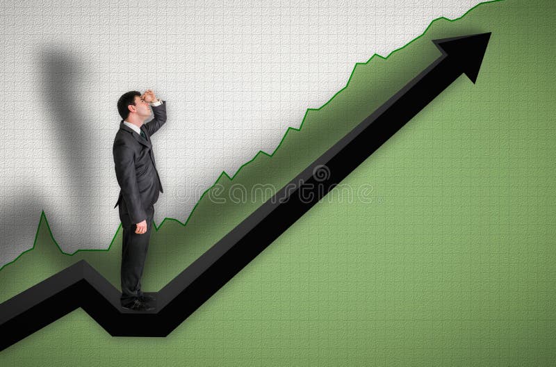 Hombre de negocios que se coloca en un gráfico y que mira para arriba en los resultados imagen de archivo libre de regalías Hombre de negocios que se coloca en un gráfico y que mira para arriba en los resultados imagen de archivo libre de regalías