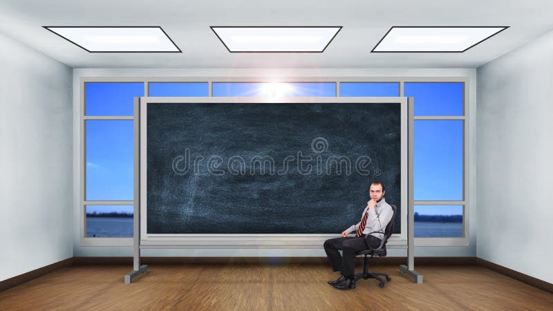 Hombre de negocios que se sienta en sala de clase imagen de archivo libre de regalías Hombre de negocios que se sienta en sala de clase imagen de archivo libre de regalías