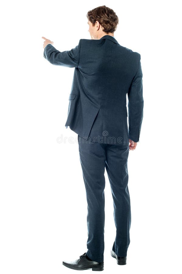 Hombre de negocios que señala en algo imagen de archivo Hombre de negocios que señala en algo imagen de archivo