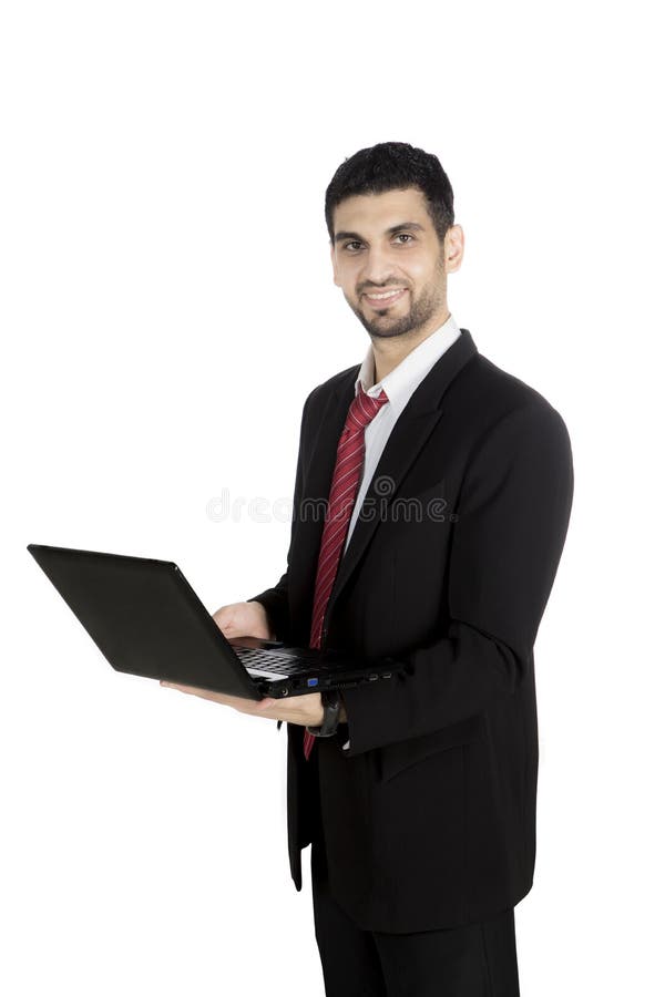 Hombre de negocios que trabaja con un ordenador portátil en estudio fotografía de archivo Hombre de negocios que trabaja con un ordenador portátil en estudio fotografía de archivo