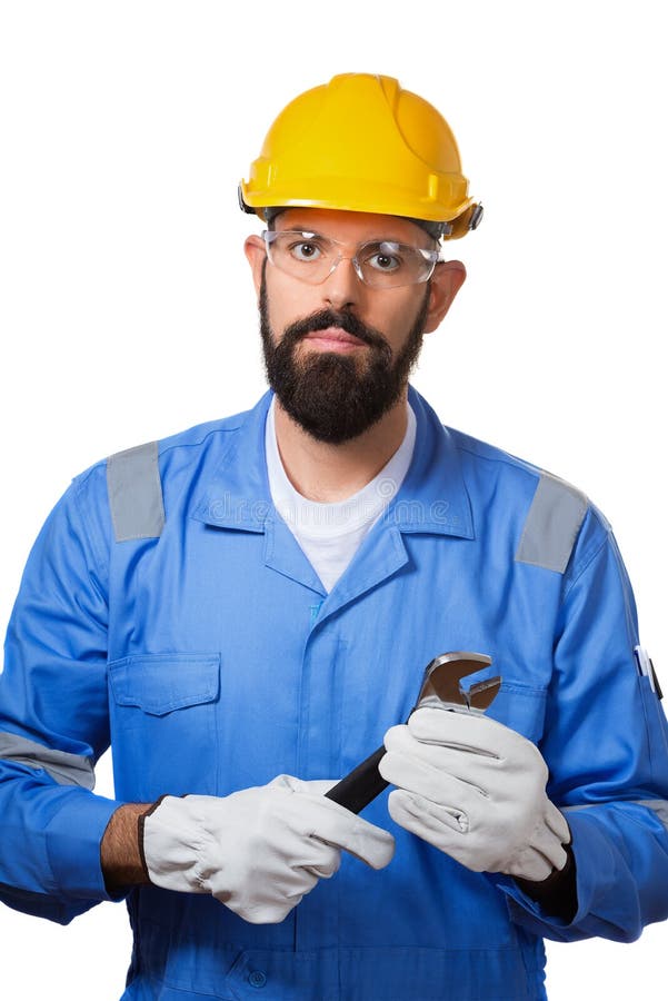 Hombre del concepto de la reparación, de la construcción, del edificio, de la gente y de mantenimiento, trabajador, en un casco a foto de archivo libre de regalías Hombre del concepto de la reparación, de la construcción, del edificio, de la gente y de mantenimiento, trabajador, en un casco a foto de archivo libre de regalías