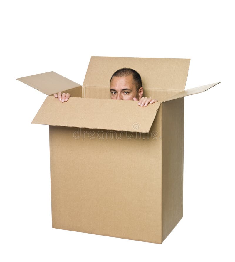 Man hiding in a cardboard box. Man hiding in a cardboard box.