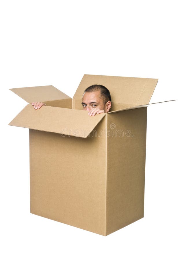 Man hiding in a cardboard box. Man hiding in a cardboard box.