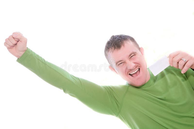Hombre feliz que sostiene la tarjeta en blanco imagen de archivo Hombre feliz que sostiene la tarjeta en blanco imagen de archivo