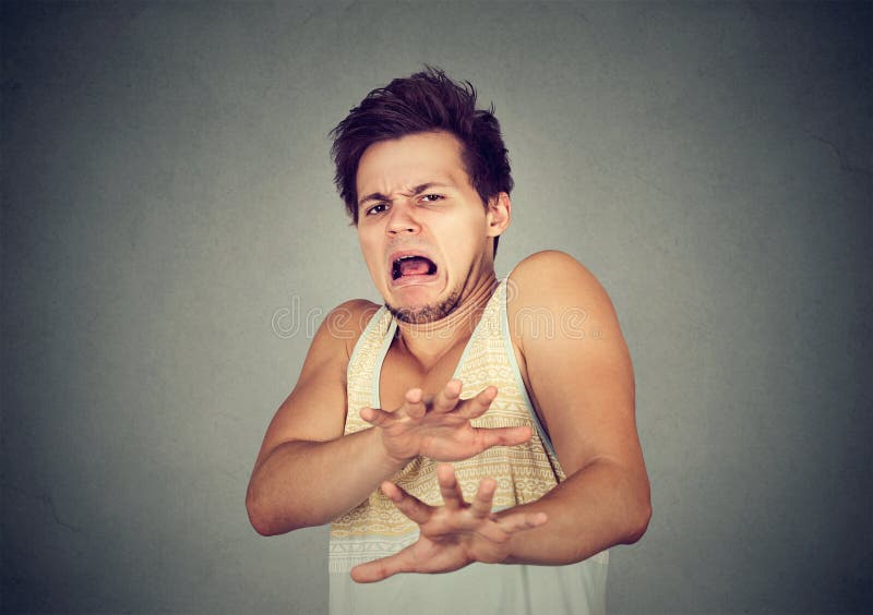 Hombre joven asqueado Emoción humana negativa fotos de archivo Hombre joven asqueado Emoción humana negativa fotos de archivo