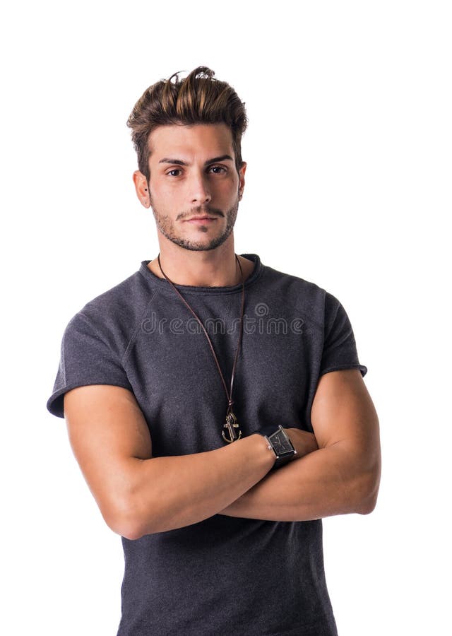 Hombre joven hermoso apto confiado en ropa casual imagen de archivo Hombre joven hermoso apto confiado en ropa casual imagen de archivo