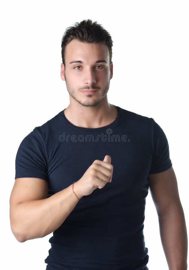Attractive and athletic young man pointing thumb finger at himself, confident expression. Attractive and athletic young man pointing thumb finger at himself, confident expression