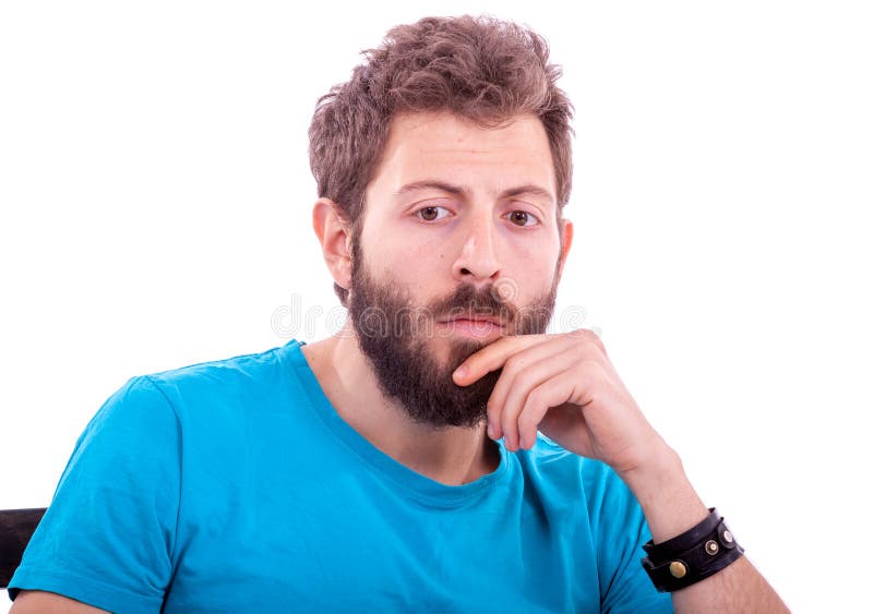 Hombre joven sonriente con la presentación de la barba imagen de archivo Hombre joven sonriente con la presentación de la barba imagen de archivo
